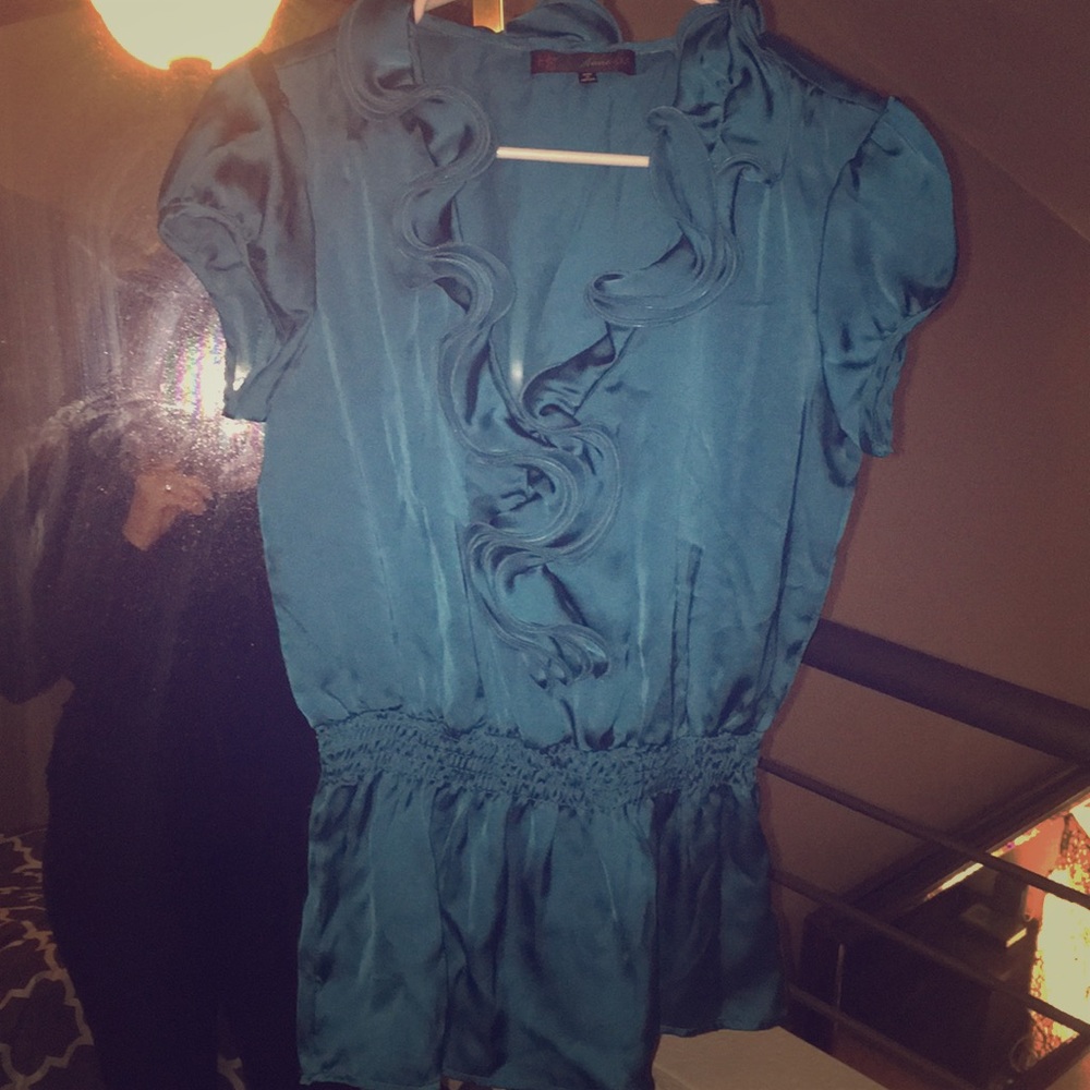 Like new silk blouse. Beautiful teal color.